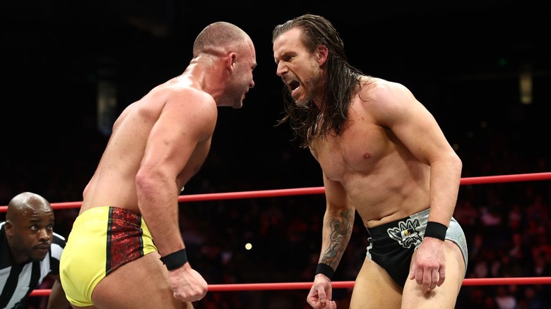 Adam Cole yelling in Daniel Garcia's face