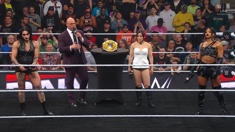 The three women and Pearce in the ring