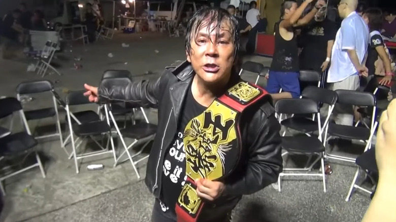 Atsushi Onita points back