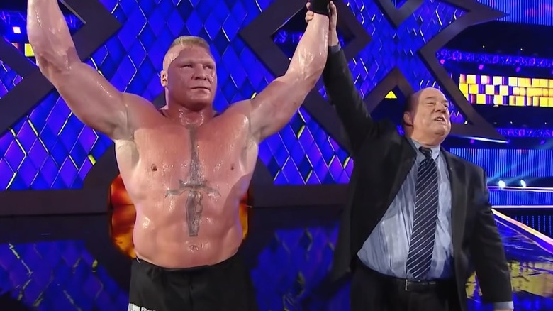Paul Heyman raising Brock Lesnar's arm