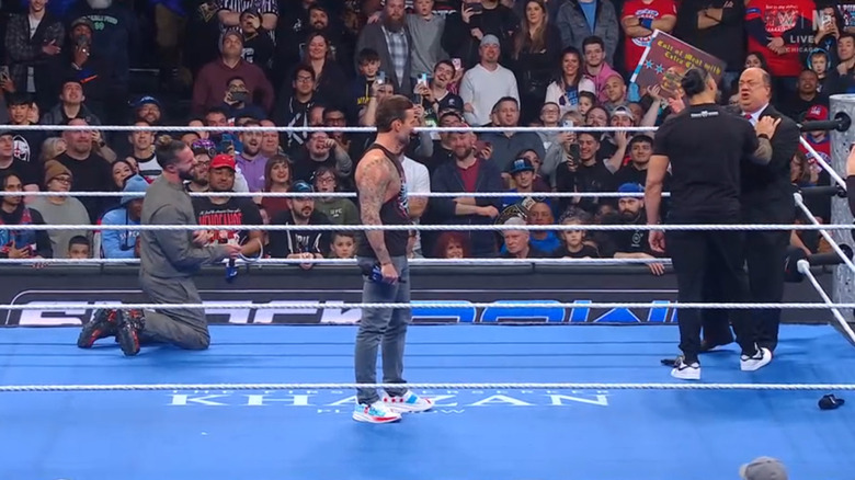 Rollins, Punk, Reigns, and Heyman in the ring