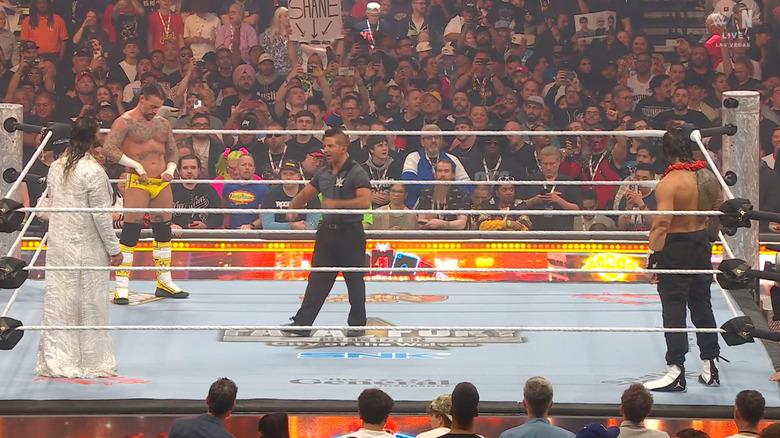 The three men inside the ring