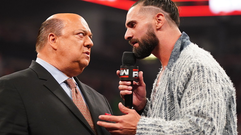 Paul Heyman and Seth Rollins