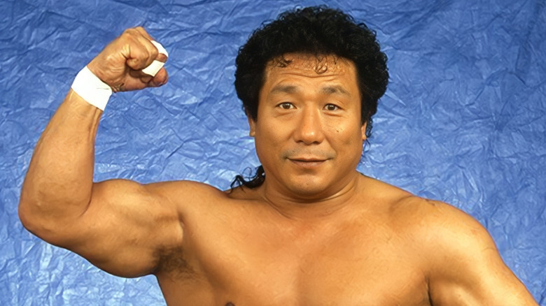 Gran Hamada poses for a headshot while flexing his right bicep