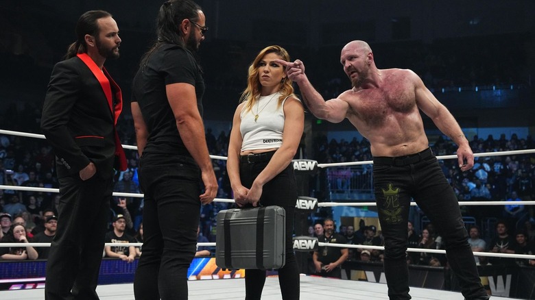 Matt and Nick Jackson in the ring with Marina Shafir and a pointing Jon Moxley on "AEW Dynasty"
