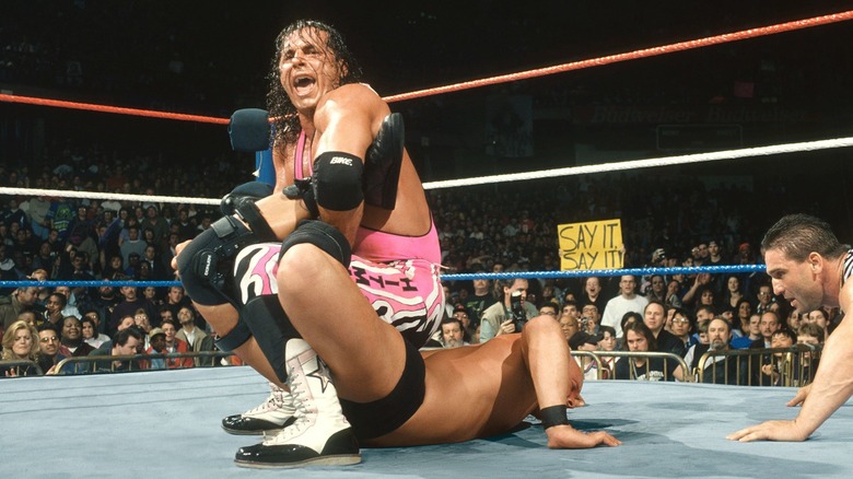 Bret Hart securing the win against Steve Austin at WrestleMania 13 with Special Guest Referee, Ken Shamrock, calling the match.