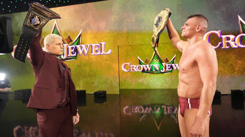 Rhodes and GUNTHER holding up their respective titles