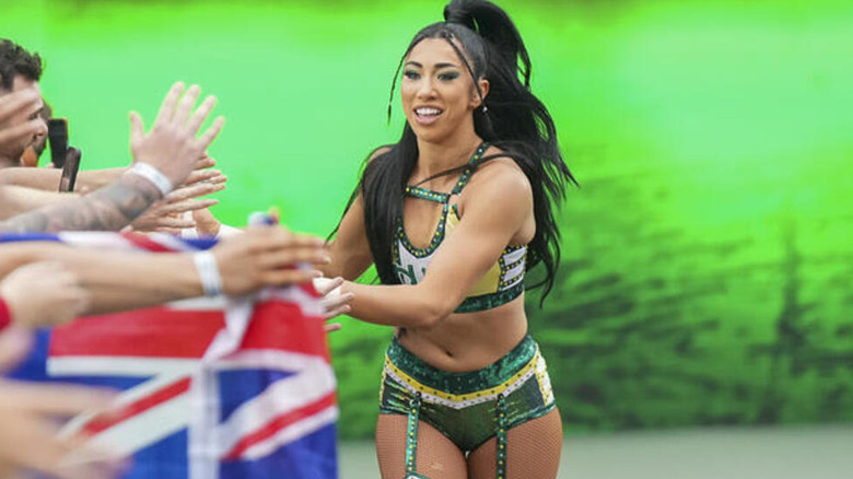 Indi Hartwell offers high-fives to fans