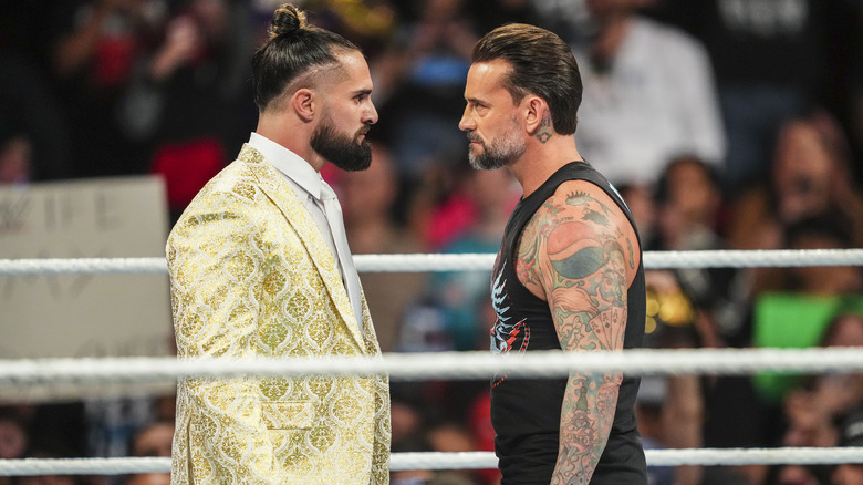 Rollins and Punk in the ring staring each other down