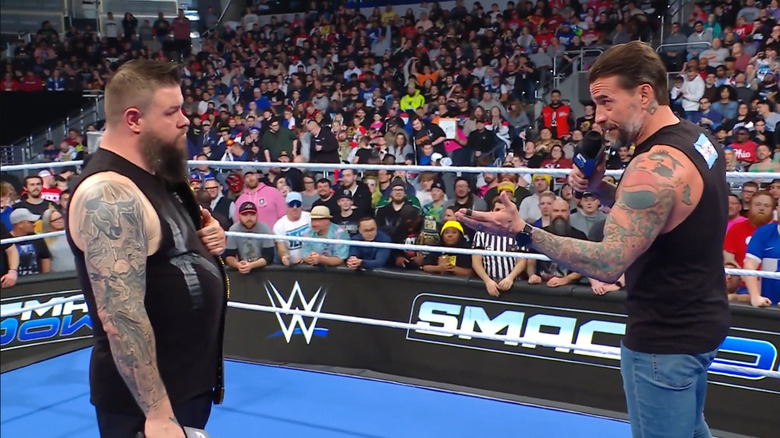Kevin Owens and CM Punk meet in the ring during "WWE SmackDown"