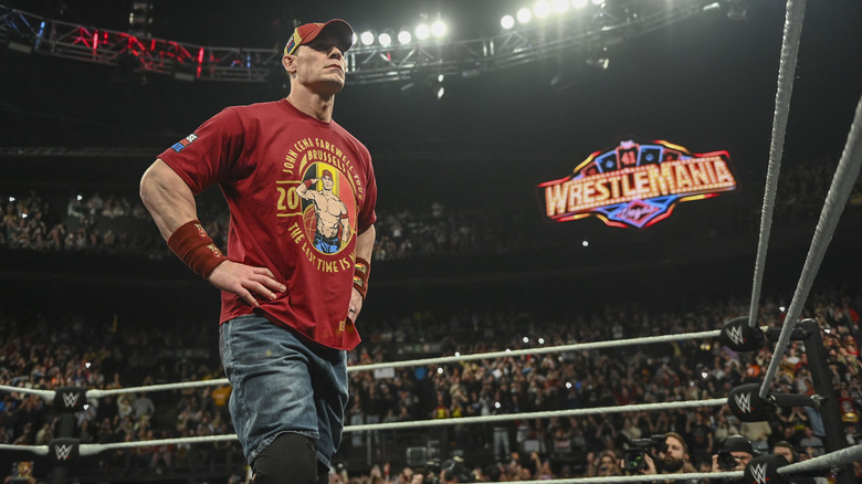 John Cena stands with his hands on his hips in the ring on "WWE Raw."