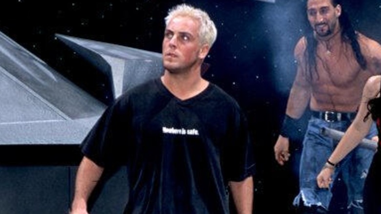 David Flair on his way to the ring with Crowbar and Daffney accompanying him.