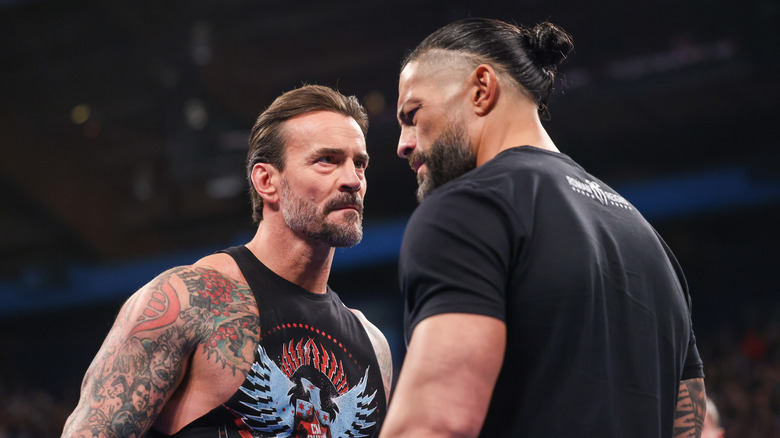 CM Punk and Roman Reigns face off