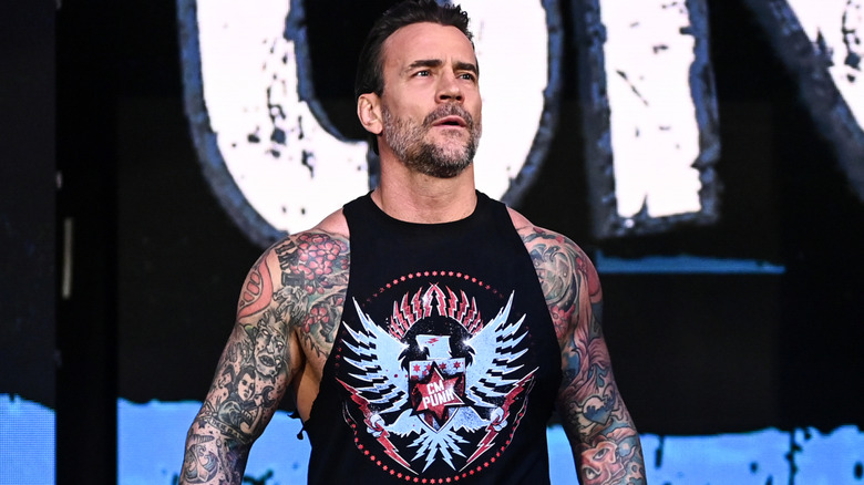 CM Punk wearing a black tank top