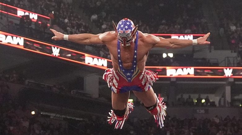 El Grande Americano flies off the top rope onto Dragon Lee during Monday Night RAW at Target Center on April 7, 2025 in Minneapolis, Minnesota.