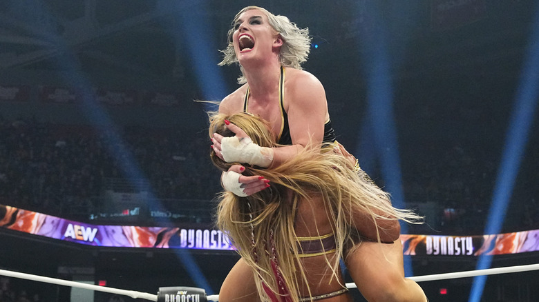 AEW Women's World Champion Toni Storm lunges at challenger Megan Bayne in the middle of the ring during their match at AEW Dynasty.