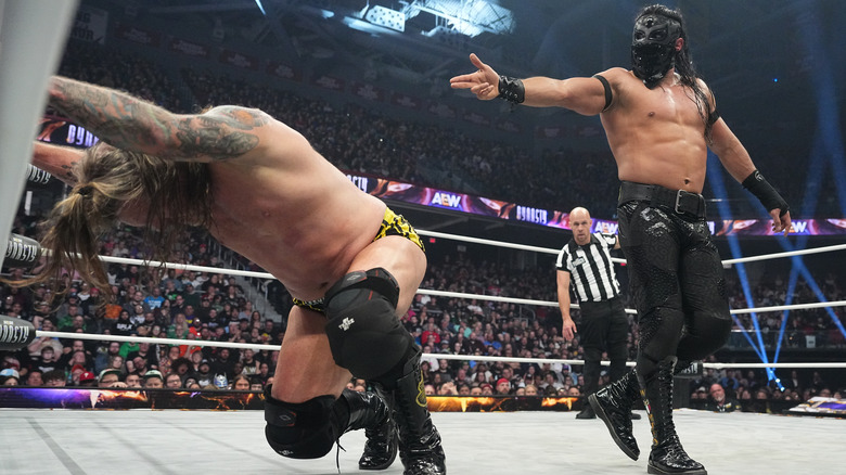 Bandido points a finger-gun towards a weary Chris Jericho.