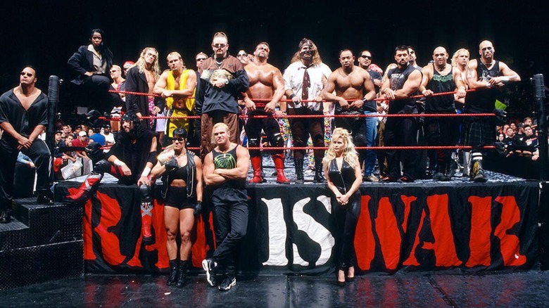 Several of the most popular WWE stars during the Attitude Era standing in and around the 