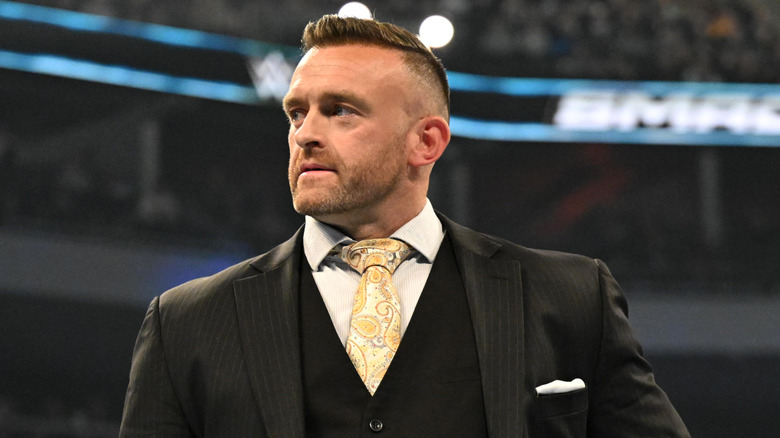 SmackDown General Manager Nick Aldis looks on during WWE SmackDown at Fiserv Forum on November 15, 2024 in Milwaukee, Wisconsin.
