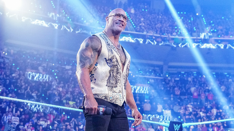 The Rock takes in the crowd's reactions during a special appearance at the 