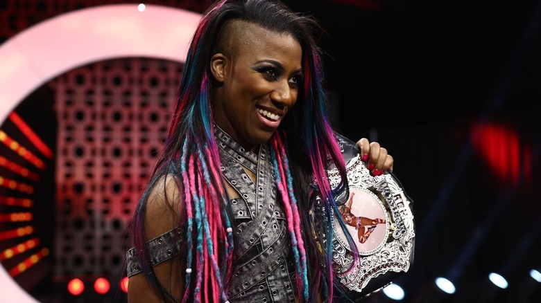 Athena holding her spinner belt