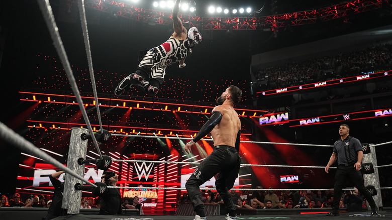 Penta and Balor battling in the ring
