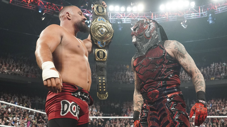 Intercontinental Champion Bron Breakker holds his title in front of Penta, one of his three WWE WrestleMania challengers
