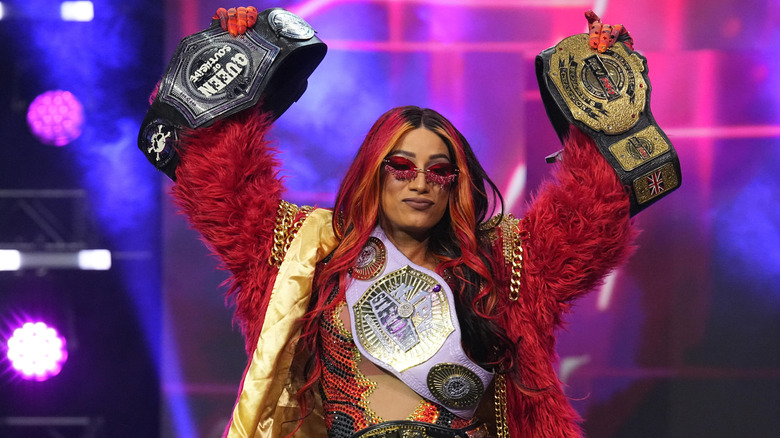 TBS Champion Mercedes Mone strides down to the ring with all four of her championship belts before her match at AEW Dynasty.