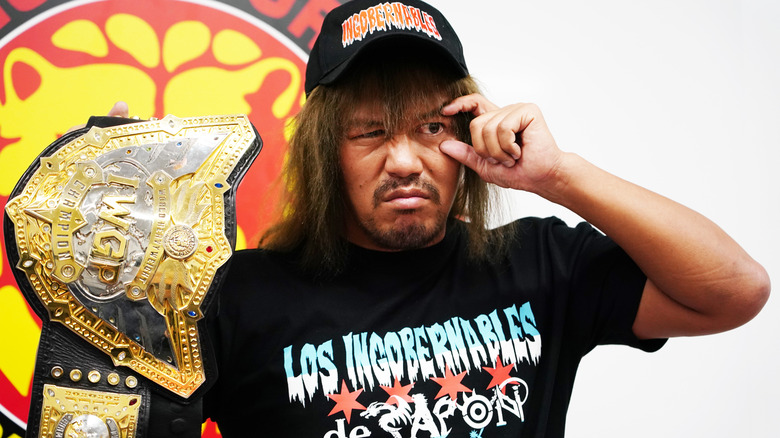 Tetsuya Naito posing with the IWGP World Heavyweight Championship during the New Japan Pro-Wrestling Conference. April, 2024