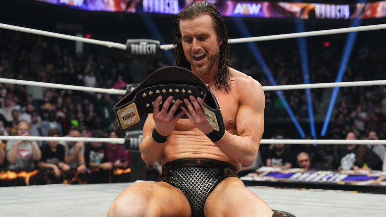 Adam Cole gazes adoringly at his new TNT Championship.