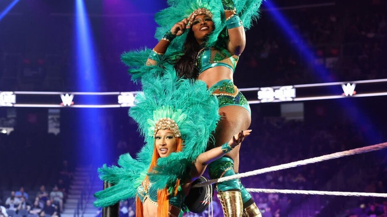 Lash Legend and Jakara Jackson pose on the ring apron in their Vegas showgirl-inspired gear before their match at "WWE NXT" Stand & Deliver.