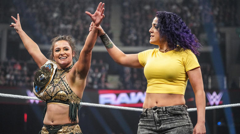 Bayley and Lyra Valkyria celebrate in the ring