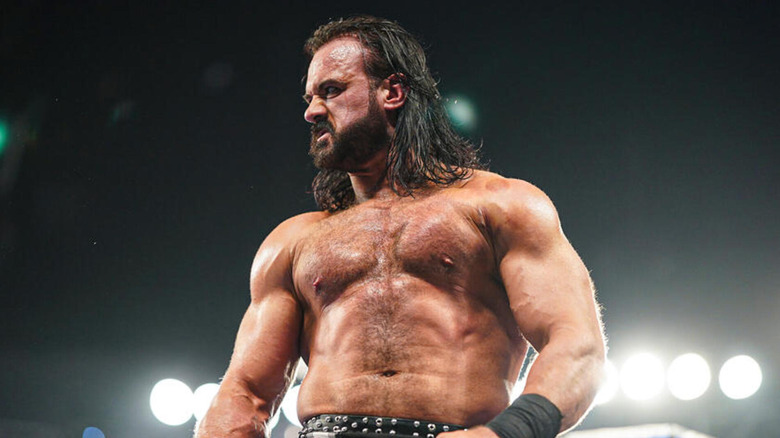 Drew McIntyre huffs as he looks off to the side post-match.