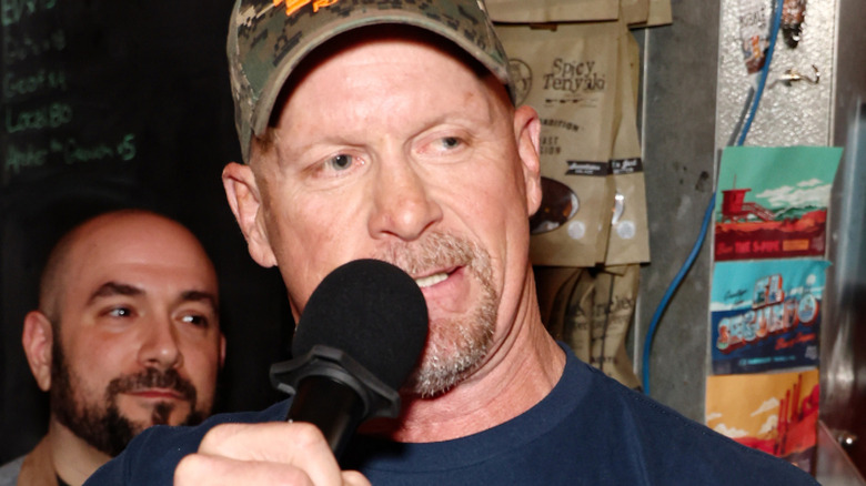 "Stone Cold" Steve Austin (C) speaks during WWE 2K23 Launch Event at El Segundo Brewing Company on March 16, 2023 in El Segundo, California.