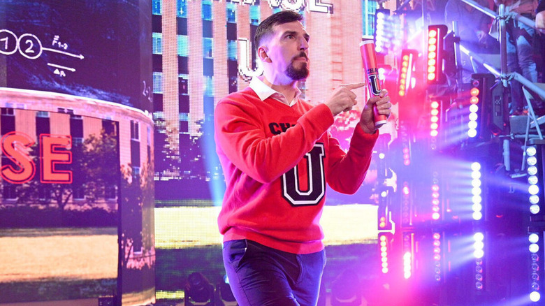 Andre Chase appears in a Chase U sweatshirt as he holds a Chase U-branded tube.