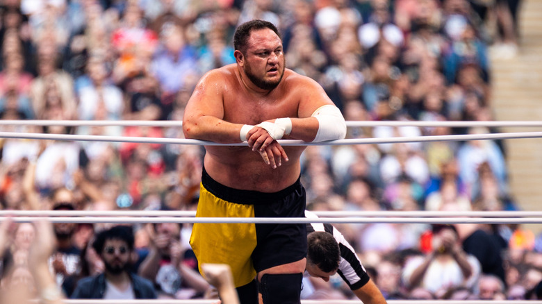 Samoa Joe leans on the ropes