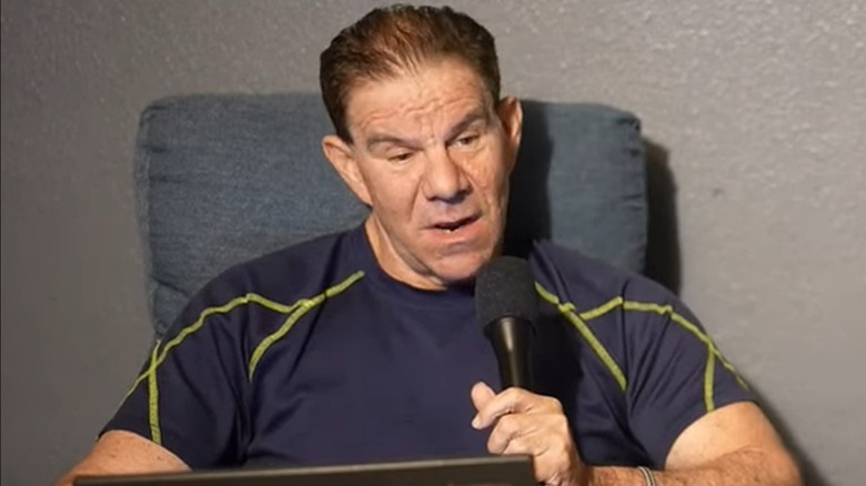 Dave Meltzer speaking into a mic