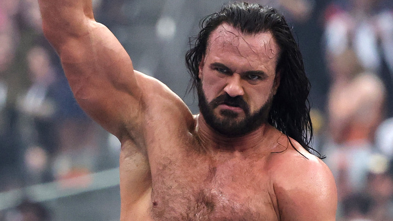 Drew McIntyre raises his hand in victory