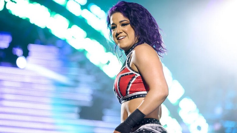 Bayley looks out into the crowd with a smile before her match