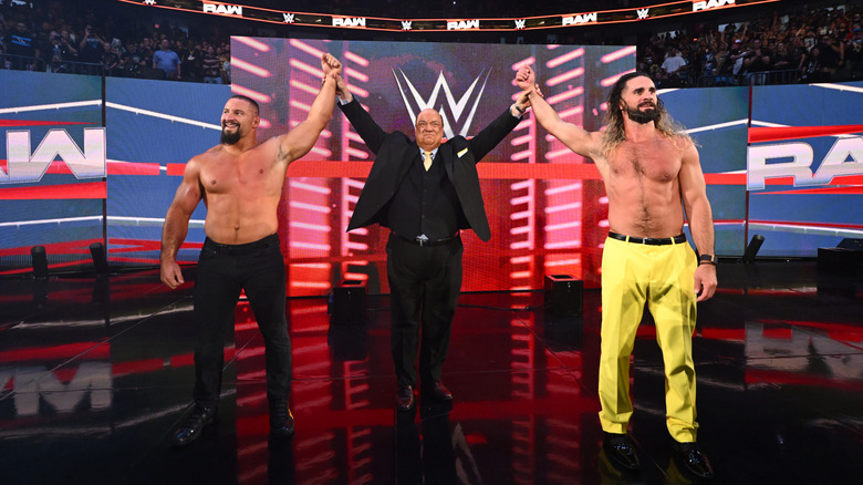 Breakker, Heyman, and Rollins on the entrance ramp