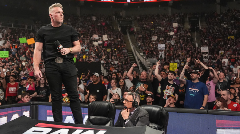 McAfee standing on top of the announce desk