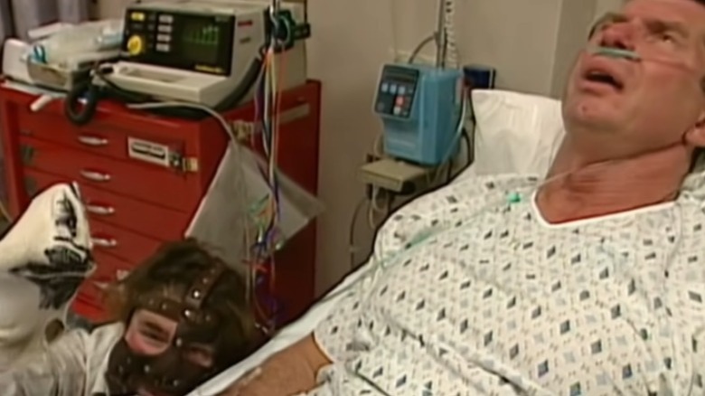 Mick Foley and Socko sneak up on Vince McMahon