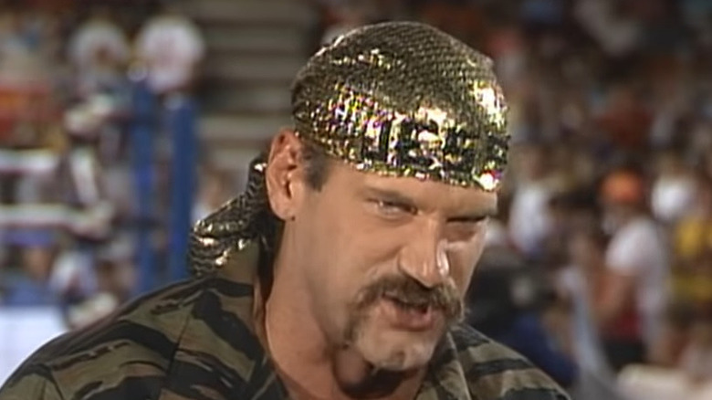 Jesse Ventura wearing a gold bandana