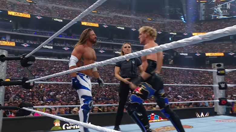 Styles and Paul staring each other down in the ring