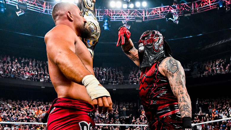 Bron Breakker holds up Intercontinental title belt while Penta makes "cero miedo" gesture in front of him on "WWE Raw"