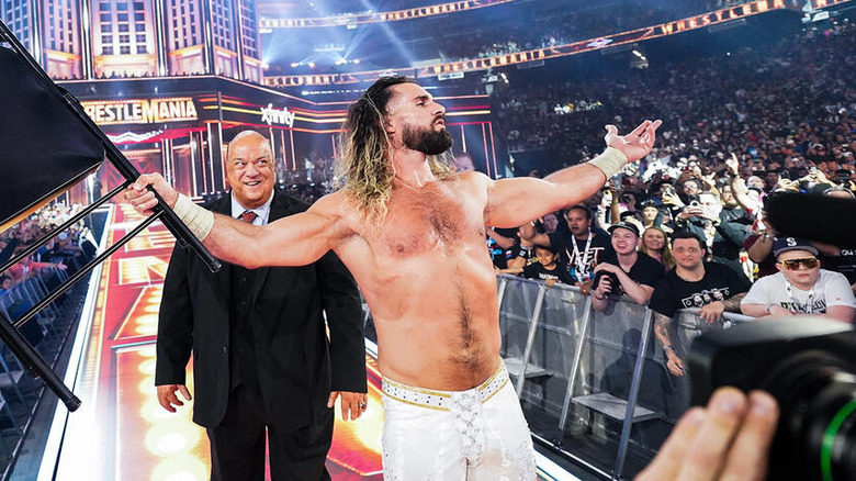 Seth Rollins holding a chair with Paul Heyman standing behind him at WrestleMania 41