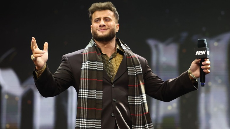 MJF spreading his arms and smiling