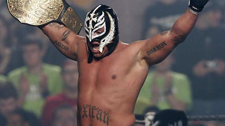 Rey Mysterio holding the WWE World Heavyweight Championship