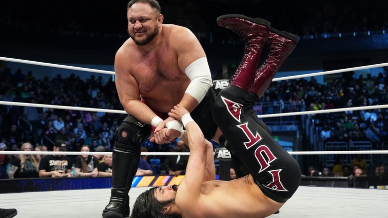 Samoa Joe smiles as he torments Wheeler Yuta with a wristlock on "AEW Dynamite."