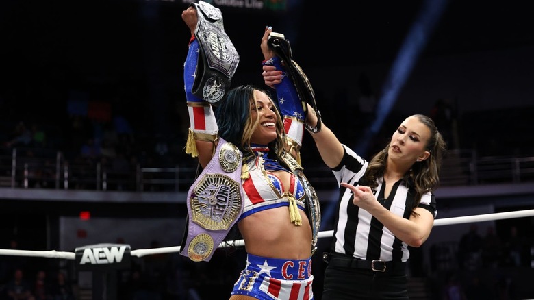 Mercedes Moné with all her belts